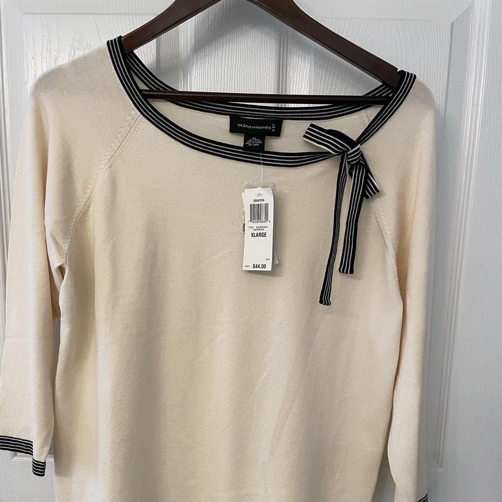 Women’s xl white with black and white bow.